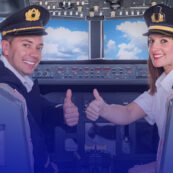 a male and a female pilots happy and confident in the cockpit